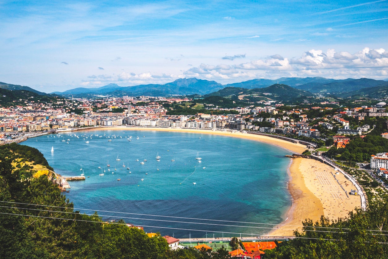Golden sand and green hillsides border San Sebastian