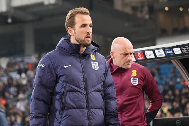 <p>Unfamiliar territory: Harry Kane heads for the bench before England’s game against Greece in Athens on Thursday</p>