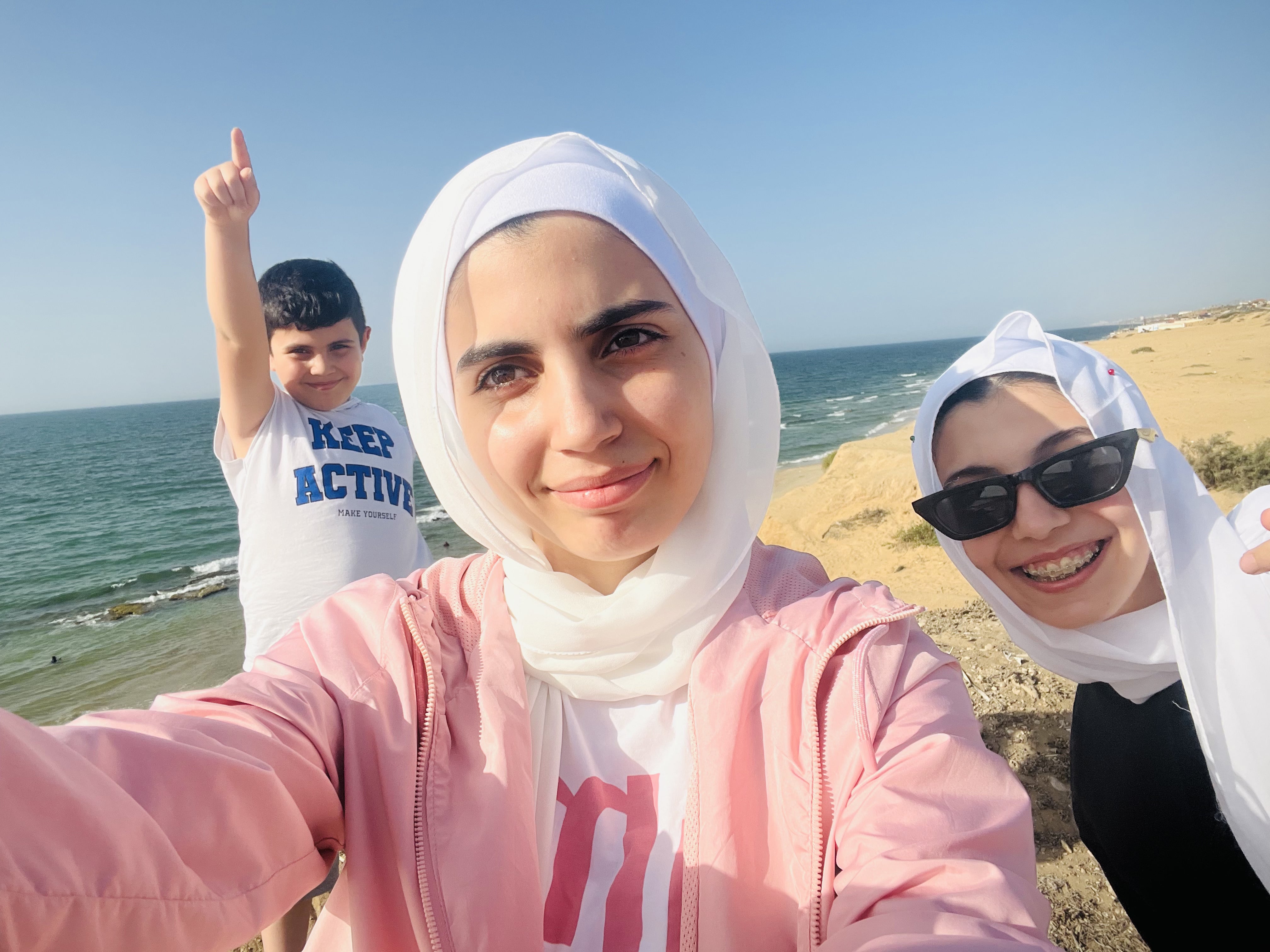 Ayham, Hala and Nada on a family trip to a beach before war broke out