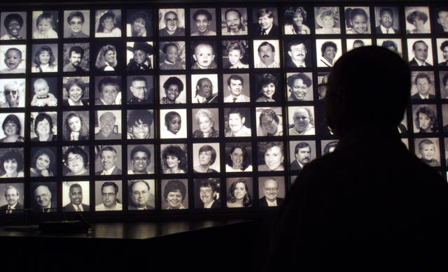 <p>A visitor looks at the faces of some of the victims of the Oklahoma City bombing at the Oklahoma National Memorial museum in Oklahoma City June 12, 2001, one day after the execution of Timothy McVeigh. </p>