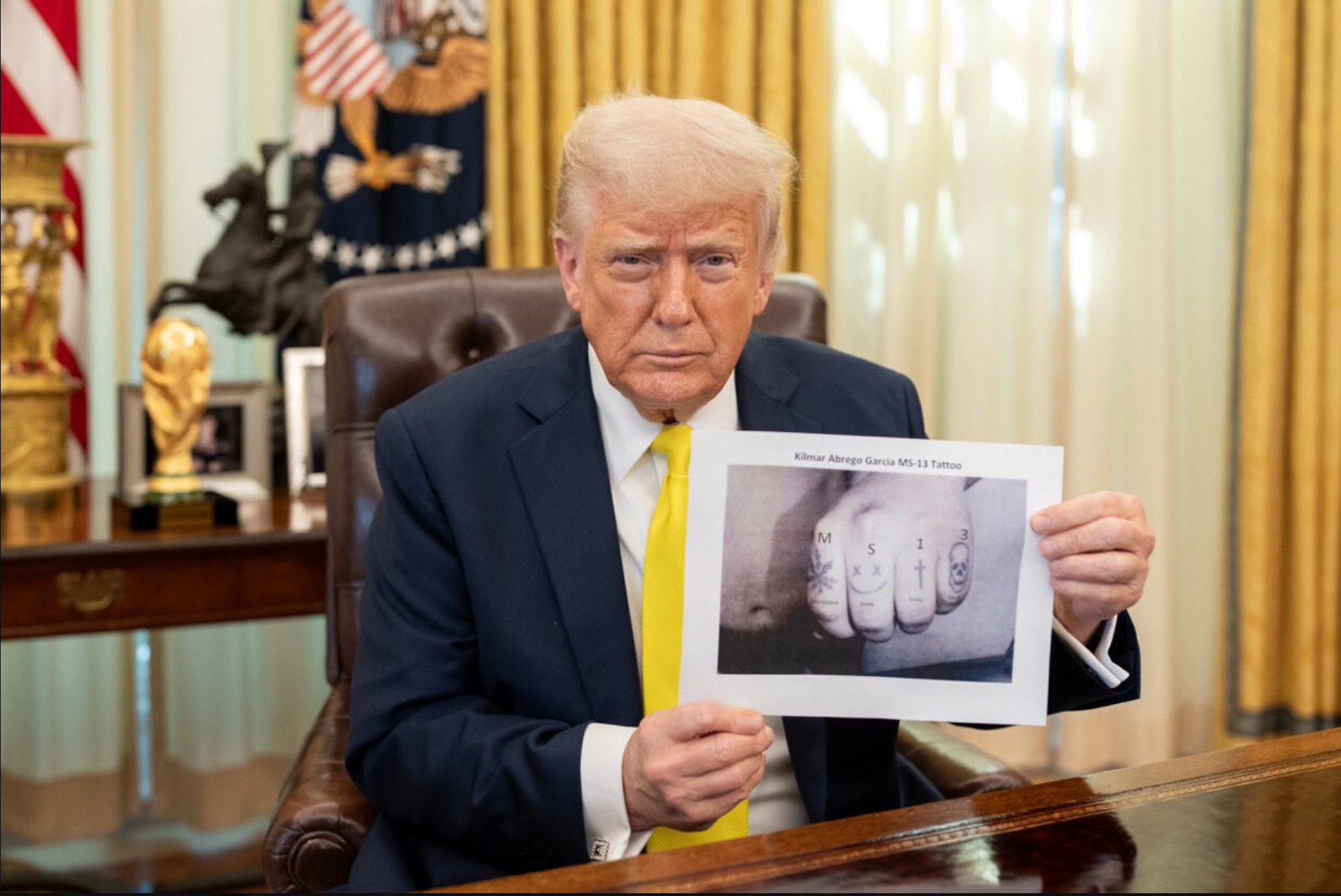 Donald Trump posed with what appears to be a digitally altered image and claimed Kilmar Abrego Garcia has 'got MS-13 tattooed onto his knuckles' in what appears to be a digitally altered image