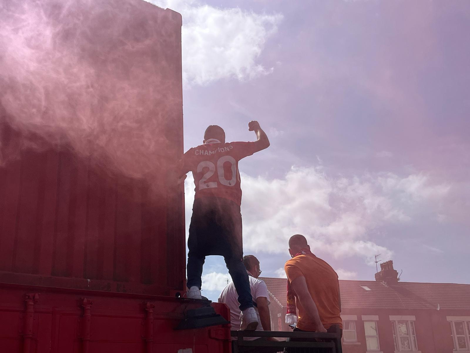 A fan celebrates Liverpool's 20th top-flight title