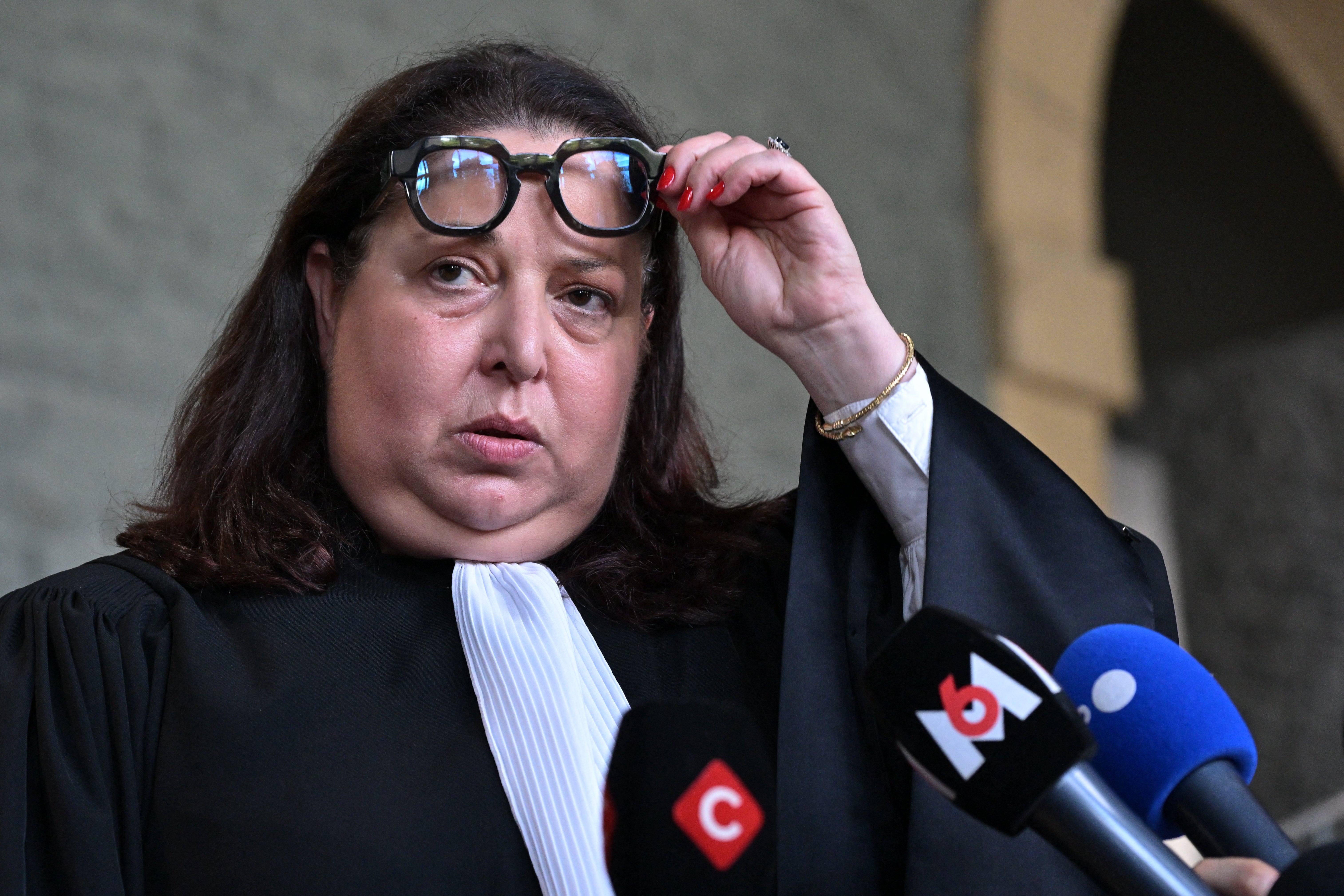 French lawyer Myriam Guedj Benayoun, representing the civil parties, answers journalists' questions at the courthouse at the end of the trial