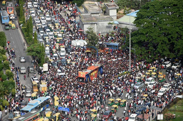 <p>Fans throng the streets in Bengaluru on June 4, 2025, to celebrate a day after Royal Challengers Bengaluru's victory at the Indian Premier League (IPL) Twenty20 final cricket match</p>
